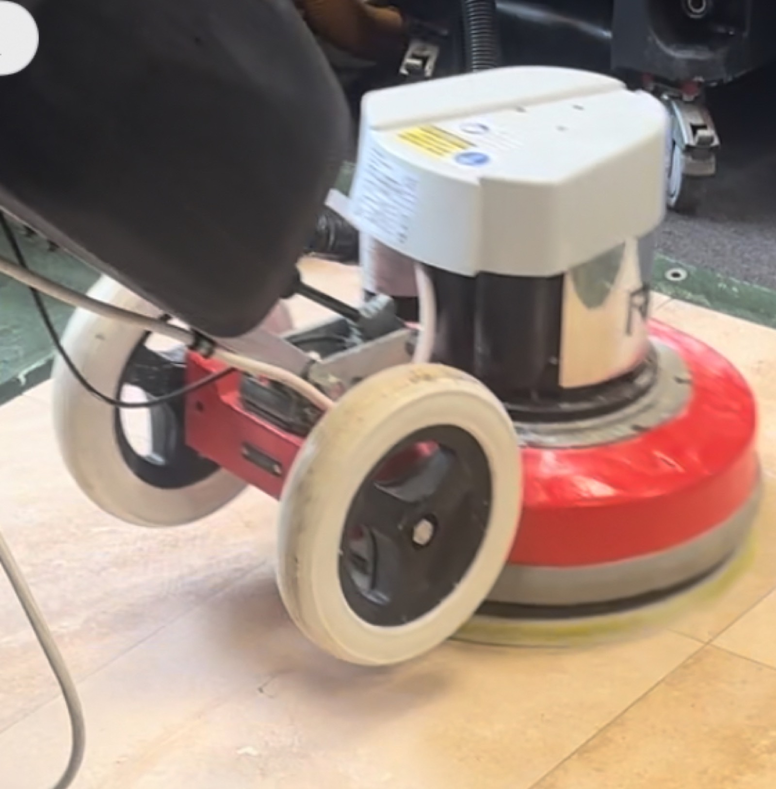 Rotary machine buffing a stone floor